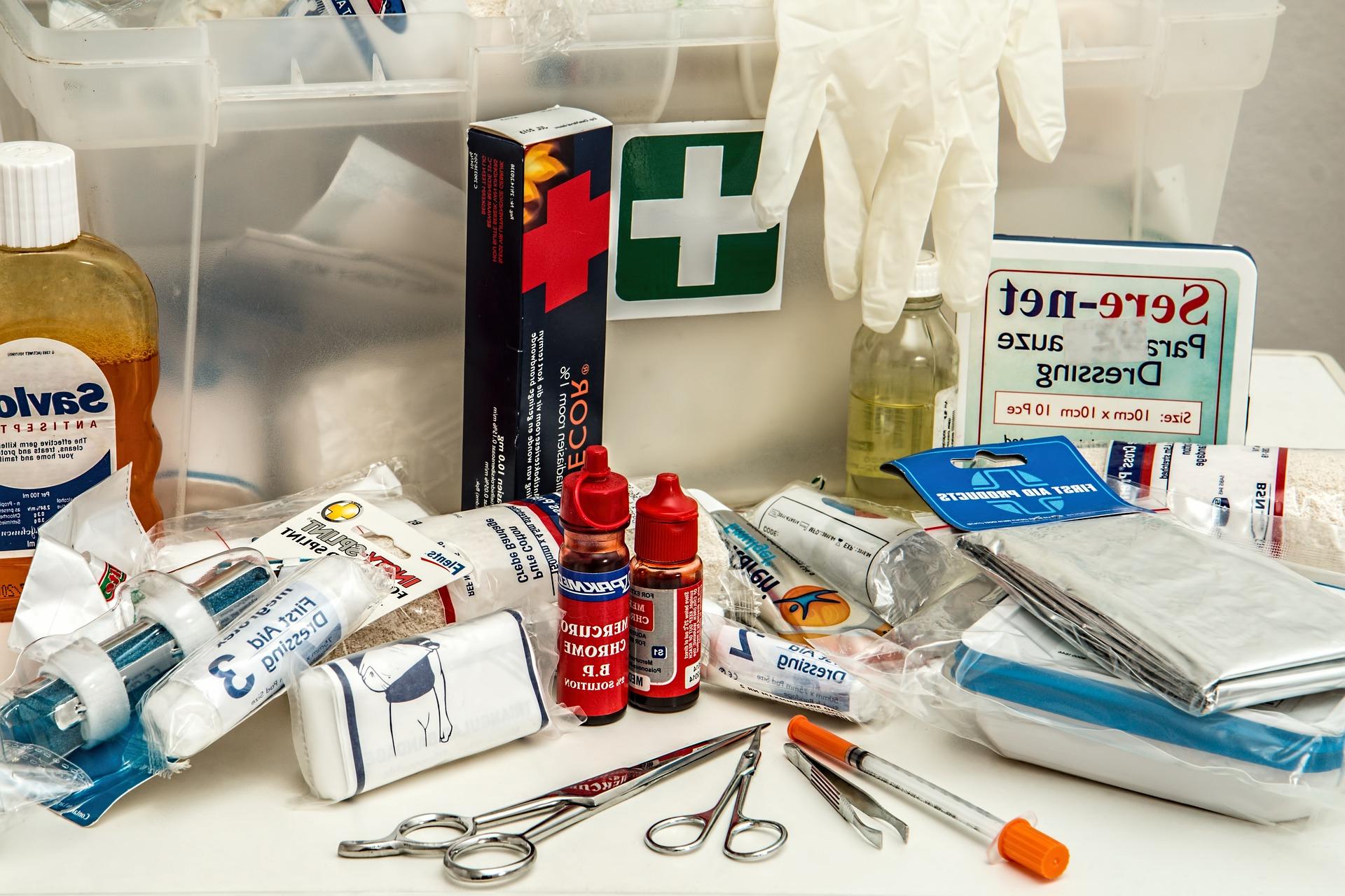 A pile of first aid supplies strewn out on a table